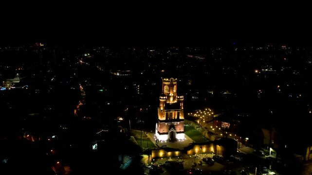 4K Aerial drone video of Gardos Tower in Zemun, Belgrade, Serbia on a clear winter night. Wonderful monument from Austro-Hungarian era standing out lit in the dark