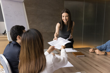 Project manager offering plan, management strategy to diverse team, share financial reports, gives...