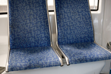 blue seats in an empty bus. Urban transport