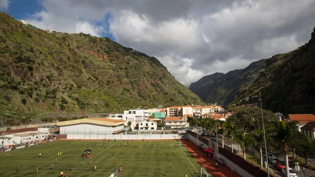 Football match in a town caught between two ridges of mountains, Weekend sport event in Madeira island, Ribeira Brava town