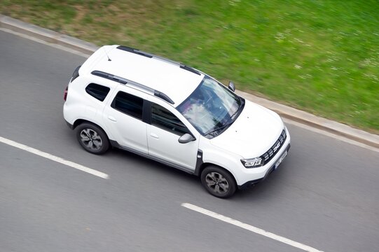 White Dacia Duster SUV crossover car with motion blur effect