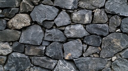 Obraz premium Textured Gray Stone Wall Background for Interior and Exterior Design