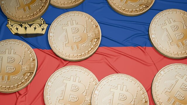 Several bitcoins are laid out on the flag of Liechtenstein
