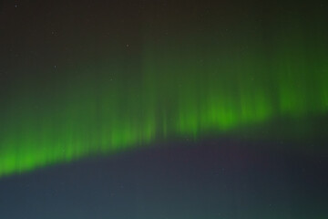 Vivid green aurora borealis lighting up the night sky in Hveragerdi, South Iceland