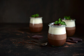Mousse dessert three chocolates in a vintage jars.
