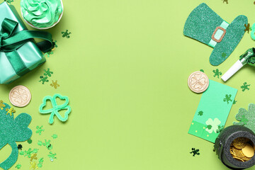 Gift box with cupcake and decor for St. Patrick's Day on green background