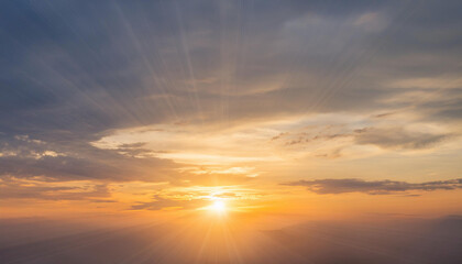 Obraz premium Sun Setting Over Clouds in Sky and Copy Space