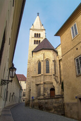 historic street in Prague with the church