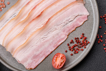 Fresh raw bacon sliced with spices and herbs