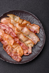 Delicious bacon in the form of slices with salt, spices and herbs