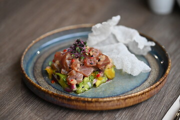 Tuna Tartare with Rice Crackers – Asian-Style Dish on a Wooden Table