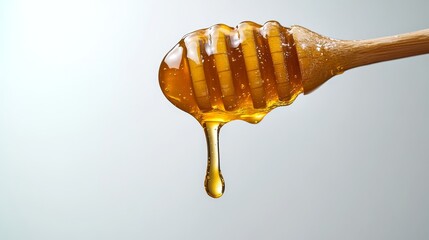 Liquid Honey Dripping from Wooden Dipper on Light Gradient Background, Food Photography.