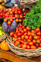 Cherry tomatoes with kale and purple cabbage in basket