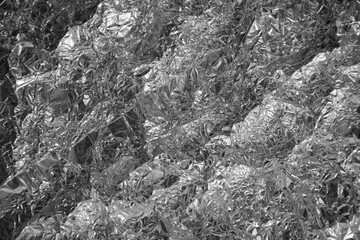 Fototapeta premium Processed collage of shiny metal silver gray foil crumpled packaging material texture
