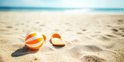 Obraz premium A cheerful setting with playful beach slippers and a fun beach ball on the shore.