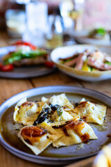 Plated ravioli with gourmet presentation