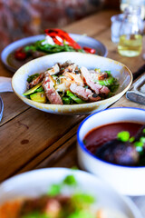 Sliced duck breast salad with avocado and seeds