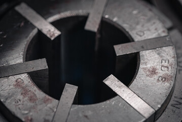 Milling chucks of various sizes on a shelf in a small workshop, West Sussex, UK