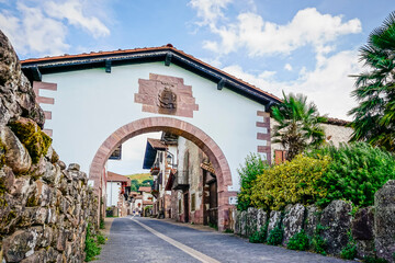 Street in a village with a semicircular arch made of stones