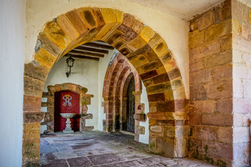 Fototapeta premium Street in a village with a semicircular arch made of stones
