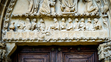Images carved in stone located in the portico of a church