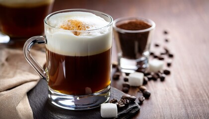 Creamy coffee drink in a glass mug