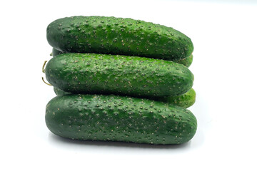 Fresh green cucumbers on a white background