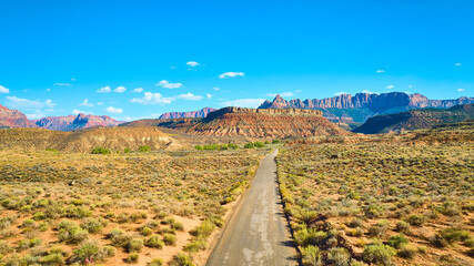 Aerial of Desert Road and Majestic Mountains in Utah