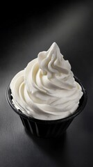 Whipped Cream in a Black Cup: A Delicious Dessert Close-up