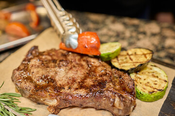 Enjoy a Delicious Grilled Steak Accompanied by Fresh and Colorful Vegetables on Your Plate