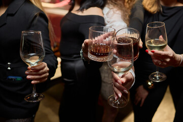 Cheers to a Fantastic Celebration Friends Joyfully Toasting with Wine Glasses in Hand