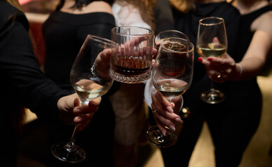 Cheers to a Fantastic Celebration Friends Joyfully Toasting with Wine Glasses in Hand