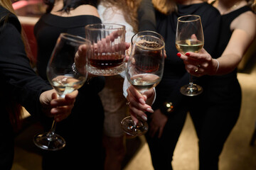 Cheers to a Fantastic Celebration Friends Joyfully Toasting with Wine Glasses in Hand