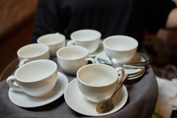 Elegant White Teacups Arranged on a Tray Perfect for a Stylish and Chic Gathering Event