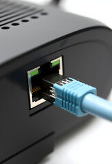 Macro of LAN ethernet port with network cable connected to router, with white tones