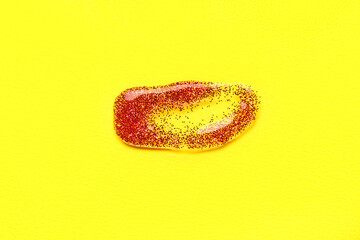 Red glitter stroke on yellow background