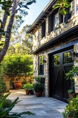 Nestled amid a vibrant expanse of greenery, this stunning stone house features a lush garden and charming pathway, all illuminated by bright daylight