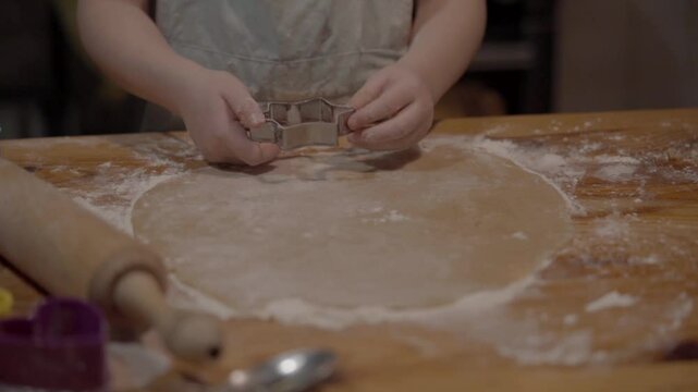 Kids learn to bake cookies in a cozy kitchen setting with parents