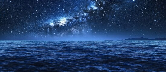 An expansive view of the night sky, featuring stars shimmering above a serene sea. 