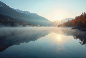Fototapeta premium Captivating Sunrise Over a Tranquil Mountain Lake With Mist and Reflections