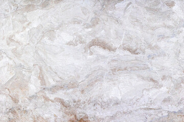 Textured white marble surface with natural veining patterns
