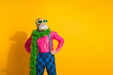 Photo of retired man look empty space boa showman dressed pink shirt vintage plaid pants fancy clothes isolated on yellow color background