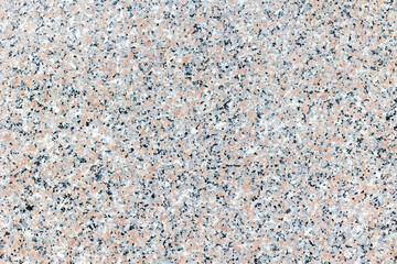 Speckled granite surface with pink, black, and white pattern