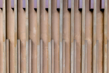 Geometric vertical wooden patterns on modern architectural wall