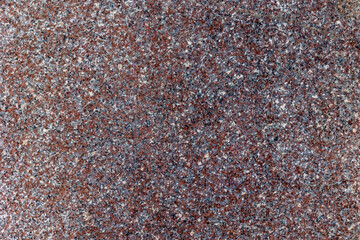 Granite texture with brown and gray speckles creating a natural stone surface