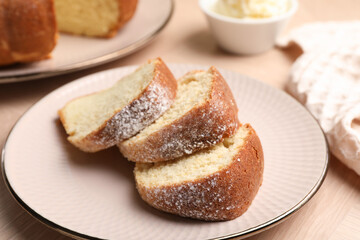 Pieces of freshly baked sponge cake on table, closeup