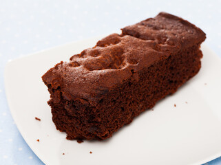 Fresh brownie on wooden background, sweet food