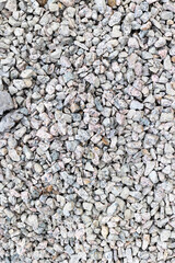 Coarse gravel texture with varied gray stones for construction and landscaping