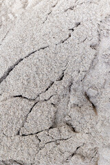 Fine gray sand texture with natural cracks and patterns