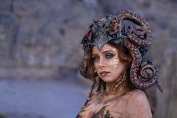 beautiful girl in the costume of the sea witch Ursula, against the background of the sea, close-up, portrait
